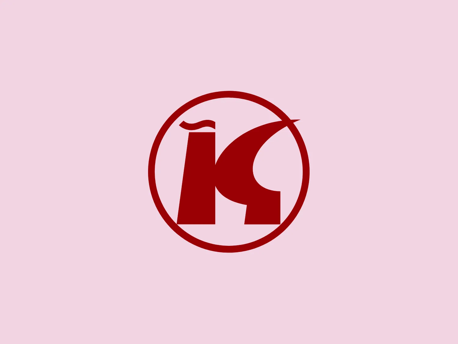The Konsum logo incorporates a stylized lowercase 'n' merged with a partial uppercase 'K' within a circle. The letters have a modern, bold, sans-serif font style and are colored in a vivid red, contrasting sharply against a white background to exude energy and passion. The design balances sharp and curved lines, creating a dynamic and professional aesthetic. The circular boundary encapsulates the brand identity, conveying a sense of completeness and unity.