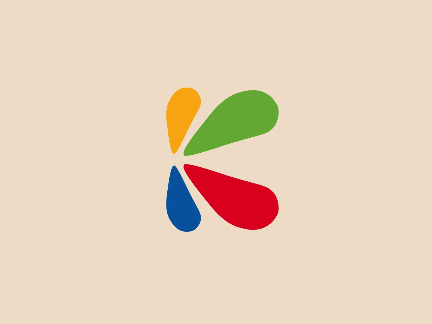 The Plásticos Kendy logo displays a straightforward design with four teardrop shapes or petals in vivid yellow, red, blue, and green colors, arranged to create a pinwheel-like pattern. The flat design, lacking gradients or shadows, exudes a modern and minimalistic aesthetic, while evoking a feeling of unity, diversity, and energy.