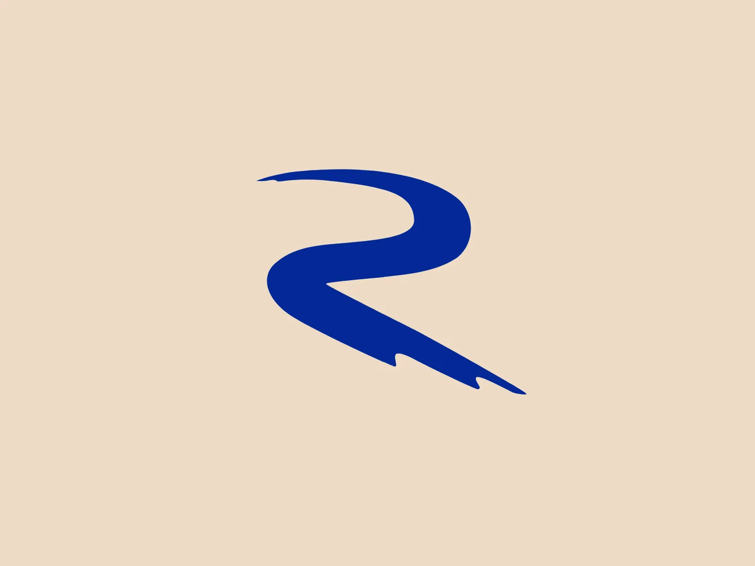 The logo for Renaissance Construction presents a stylized, abstract form resembling a dynamic, flowing ribbon or brush stroke with a sharp tail end. The solid, saturated blue tone suggests professionalism and trust. The minimalist design and sleek curvature convey a modern aesthetic. The absence of additional elements or text emphasizes its simplicity. The bold blue color of the logo would complement a light neutral background well, without overwhelming the design.