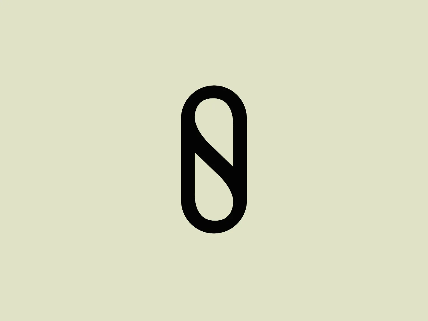 The Slater Designs logo is characterized by a bold, black color and features an abstract shape resembling a vertically-oriented pill or oval. A white, sinuous line cuts through it diagonally, creating a dynamic contrast. The design is minimalistic, with clean lines emphasizing a sleek and contemporary aesthetic.