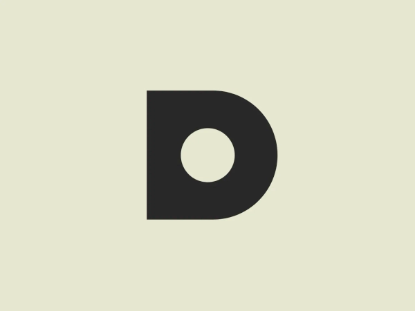 What catches our eye is the bold geometric "D" logo of Domashniy, with its sleek fuchsia color and clean, contemporary design.