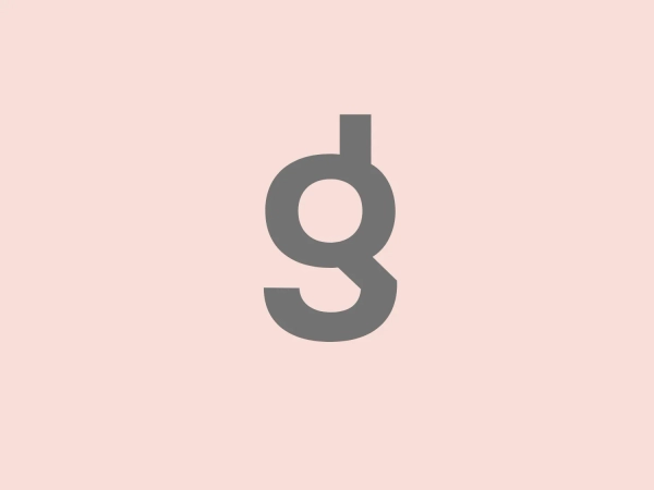 What catches our eye is the unique and modern design of the lowercase 'g' in the Enigma logo, along with the warm, energetic color choice.