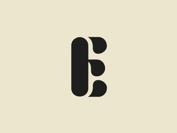 What we like is the modern and clean appearance of the stylized letter "E" in the Eatertainment logo, created from bold, rounded, interlocked geometric shapes.