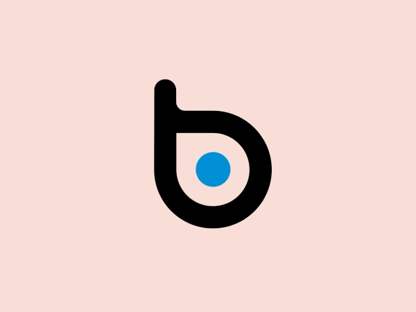 The BlueDot logo is a stylized lowercase letter 'b', combining geometric forms. The main form is a bold, black loop that encircles a smaller, solid blue circle. The design is simple, modern, and clearly contrasts the deep black against the bright blue, giving it a striking and easily recognizable appearance. Due to the minimalistic design and clean lines, the logo conveys a contemporary and sleek aesthetic.