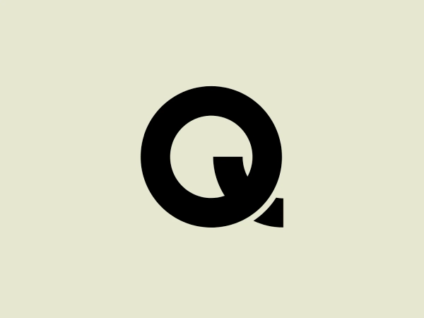 The Q Acoustics logo showcases a striking, black letter "Q" with a unique cutout resembling a small arrow pointing to the right, located on the tail of the "Q". The design adopts a modern and minimalist aesthetic, incorporating strong geometric shapes and a monochromatic color scheme to emphasize simplicity and forward motion.