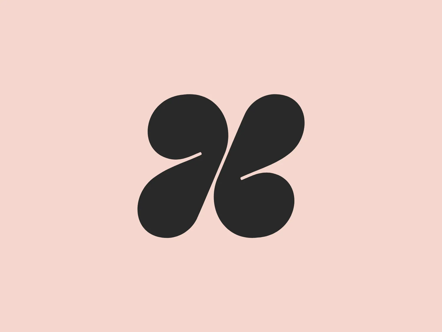 The logo presented for Hazel is a modern, abstract design comprising two mirrored elements that resemble stylized droplets or commas, creating a dynamic sense of motion and symmetry. The color of the logo is a solid, warm terracotta or rusty red, which conveys a sense of earthiness and vitality. The shapes are smooth and organic with gently curving lines and rounded terminations that convey a friendly and approachable aesthetic. The overall design is minimalistic and could symbolize connectivity, unity, or an abstract representation of natural elements.