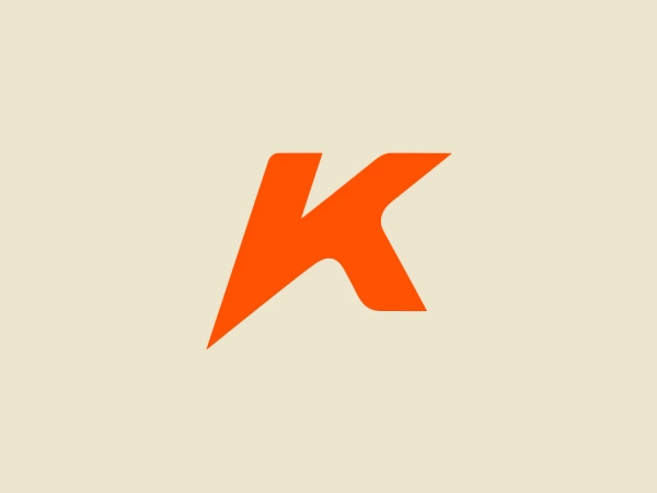 The Kenner logo is a stylized, abstract representation of the letter 'K'. It features sharp angles and bold geometry, with a right-angled triangular shape forming the backbone of the 'K' that is met by two asymmetric arms at the top and bottom. This gives the letter an energetic and dynamic feel. The color of the logo is a vivid and saturated shade of orange, which gives it a sense of vibrancy and excitement, perfect for a brand looking to stand out. The overall aesthetic is modern and minimalist with a twist of creativity. For a background that complements yet contrasts pleasantly with the logo’s vivacious orange, a light and serene shade would be ideal. The hexcode #ECE4CF, a soft, pale peach, provides a gentle backdrop that would allow the logo to remain the focal point without overwhelming it.