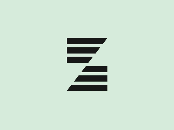 The Zepter International logo features a stylized letter "Z" composed of four horizontal bars that decrease in length from top to bottom, creating a dynamic diagonal effect resembling a set of steps or a feeling of forward motion. The design is simple and modern, with a bold, flat color scheme in a deep, saturated blue. The absence of additional design elements or embellishments emphasizes the logo's sleek, minimalistic aesthetic.