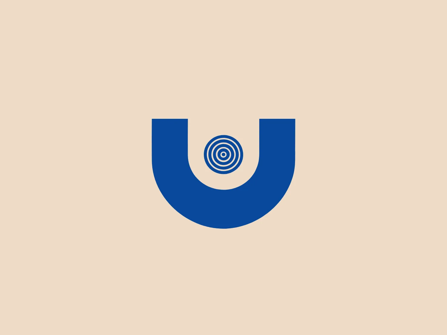 The Unilux logo features a bold, uppercase 'U' in a deep blue color, which conveys a sense of professionalism and reliability. Centered within the U is a series of concentric circles or a target-like design, giving the impression of focus and precision. The logo is minimalist and uses clean lines and symmetry, suggesting a modern and efficient brand. This design would stand out against a subtle background that complements its clarity without competing for attention.