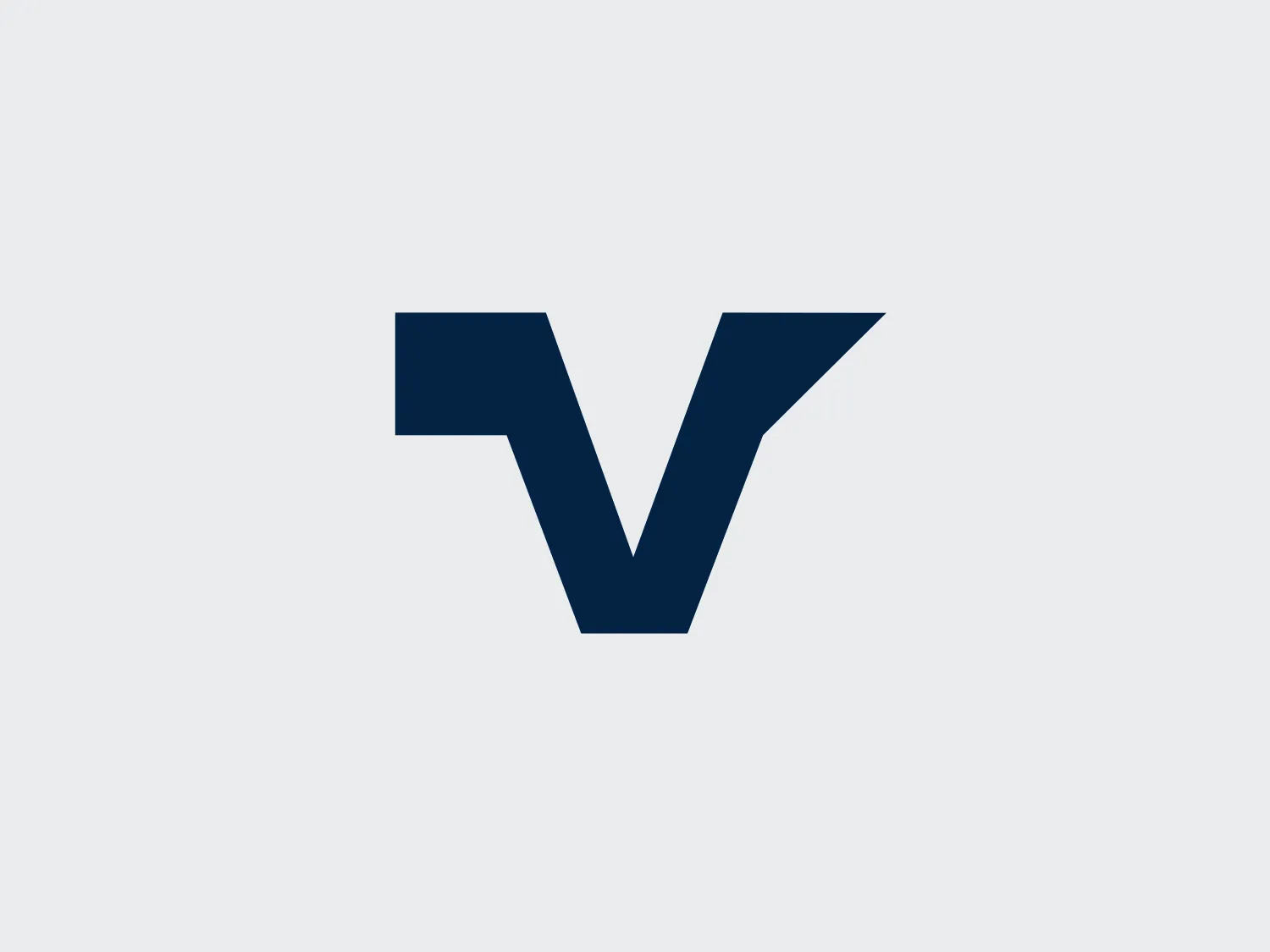 The image shows a minimalist logo composed of a stylized letter "V." The design is sleek and modern, with clean lines and sharp angles. The Vistex logo has a bold, navy blue color that conveys a sense of professionalism and reliability. The "V" has a slightly abstract look, with the arms of the letter converging at the top in a sharp point. The overall aesthetic is of contemporary simplicity and would likely represent a brand that values clarity, precision, and sophistication. Given the dark hue of the Vistex logo, a lighter background would complement it well.