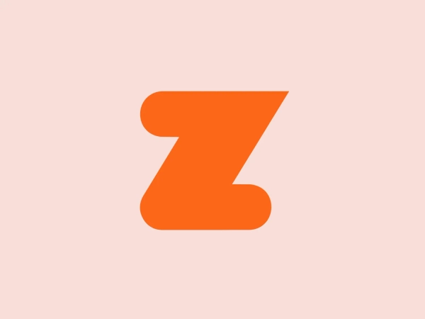 The Zwift logo is a modern and dynamic representation of the letter "Z". It features geometric shapes forming the outline of the letter with thick, bold lines. The design is simple yet striking, with a vibrant orange color that exudes a fresh and energetic feel. The sharp angles and a slight curve at the bottom add a sense of motion and progressiveness to the design. Its lack of additional embellishments makes it easily scalable and recognizable.