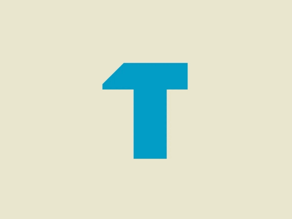 What catches our eye is the modern, asymmetrical cut on Tradify's stylized "T" logo, adding movement and a minimalist feel with its clean lines and bright cyan color.