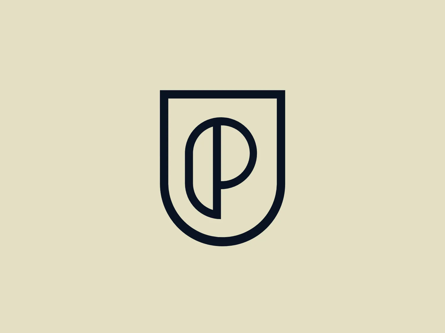 The Product School logo features a dark blue or black heraldic shield with a stylized letter "P" at the center. This modern and minimalistic "P" has a thick line weight and conspicuous curves, giving it a sense of protection or authority. The monochromatic color scheme allows for flexibility in background color choice.