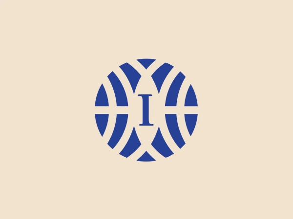 The Interstate logo showcases a bold, solid capital "I" at the center, set against an intricate backdrop of vertical bars forming a circular shape around it. The monochromatic color scheme employs a deep, rich shade of blue for both the letter and the background pattern. The design is modern and professional, juxtaposing the static letter with the implied movement of the surrounding circular elements. The clean lines and symmetry convey stability and reliability.