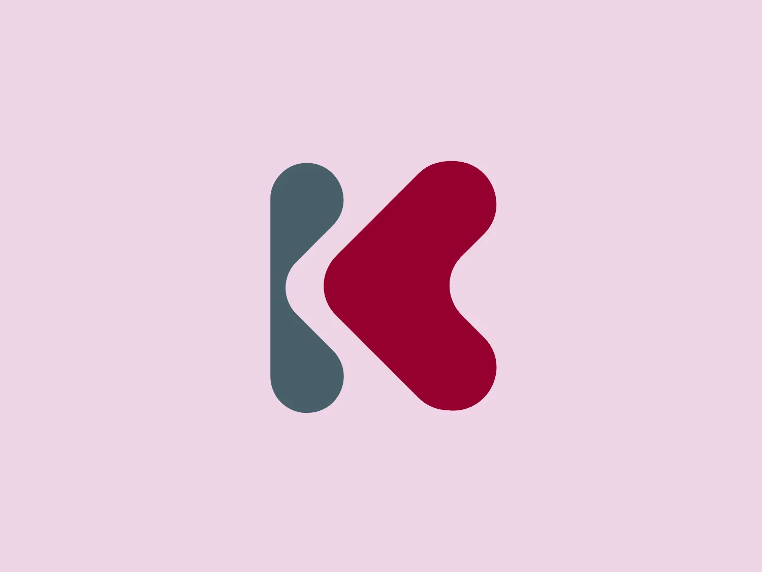 The Kaila logo is a minimalist and abstract design consisting of two shapes interacting with each other. One shape on the left side resembles the letter "K" in cool-toned, dark grey, while the shape on the right is a warm, saturated red, suggesting an abstracted arrow or a stylized letter "K." The two forms align at their tips, giving the impression of forward motion or progress. The use of negative space between the forms adds to the dynamic and contemporary feel of the design.