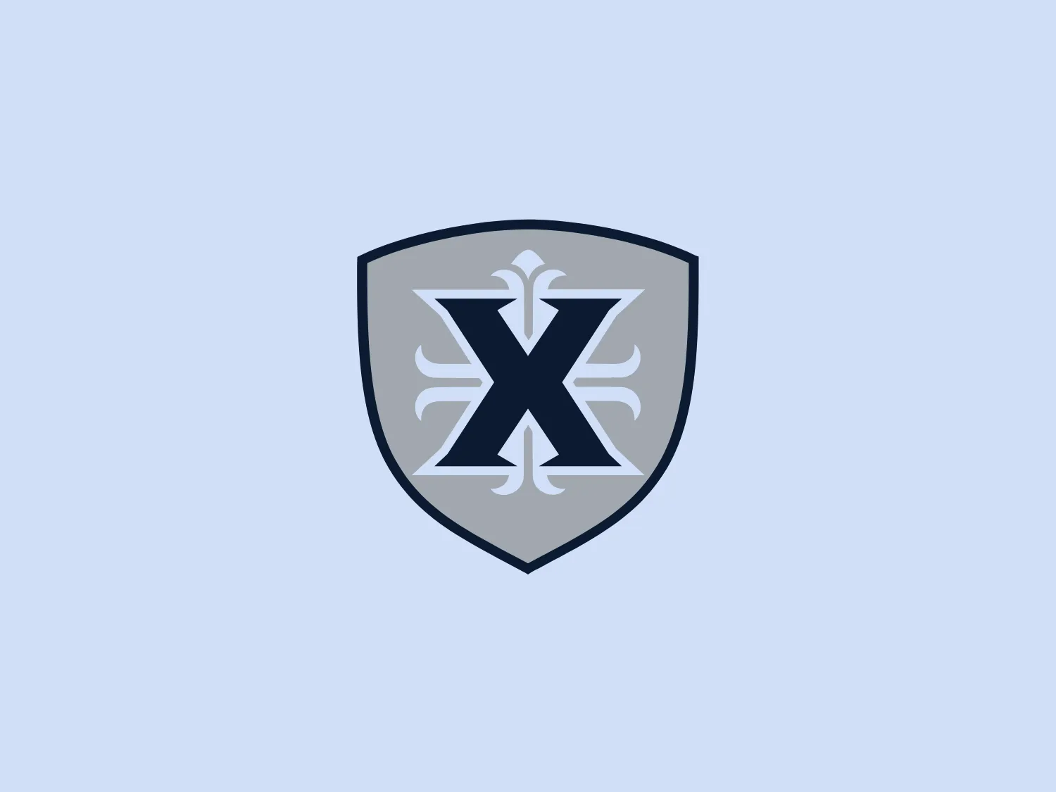 The Xavier University logo showcases a bold, symmetrical emblem that seamlessly merges modern and traditional elements. At its core is a stylized letter 'X' with elongated arms, symbolizing expansion and interconnectedness. The 'X' is depicted in white with nuanced gray shading, imparting a sense of depth and a 3D appearance. Encased within a shield-shaped outline, the emblem conveys notions of protection and resilience. The shield features a gradient from darker to lighter gray, evoking a metallic sheen, while the monochromatic color scheme exudes sophistication and formality.