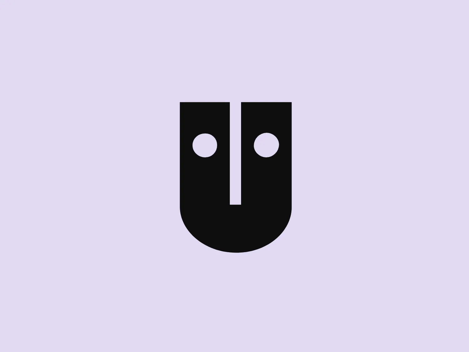 The Andrews McMeel Universal logo features a stylized representation of a theatrical mask, embodying both the comedy and tragedy aspects in a simplified form. The overall shape is an upright rectangle with a flattened bottom edge, giving the impression of a shield or badge. It is bisected vertically, with each side mirroring the other. The design utilizes a bold, purple color that gives it a modern and dynamic feel. The two circular 'eyes' and the long 'nose' create an abstract human-like face. There is a clever use of negative space that forms the outline of the mask and the division between comedy and tragedy.